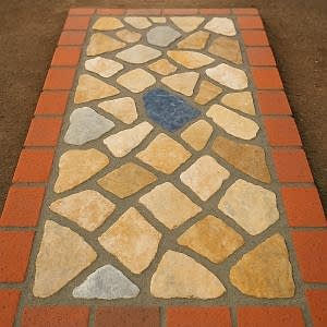 Kayrak taşı bahçe döşeme modeli – tuğla bordürlü dekoratif doğal taş zemin